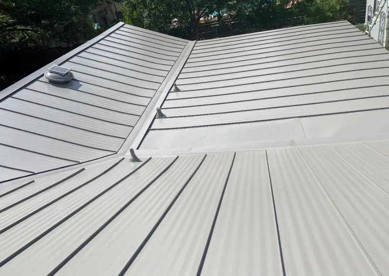 Solar attic fan installed on a metal roof for Roof Ventilation in Scappoose